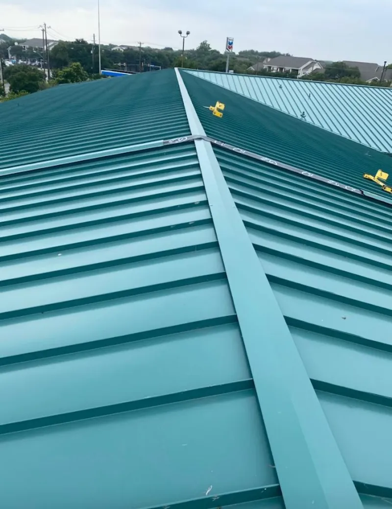 Green commercial metal roof ridge and valley for Metal Roof Repair in Whitehall